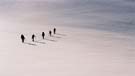 Walkers on the sea of snow