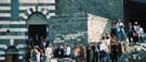 The crowd awaits the wedding procession