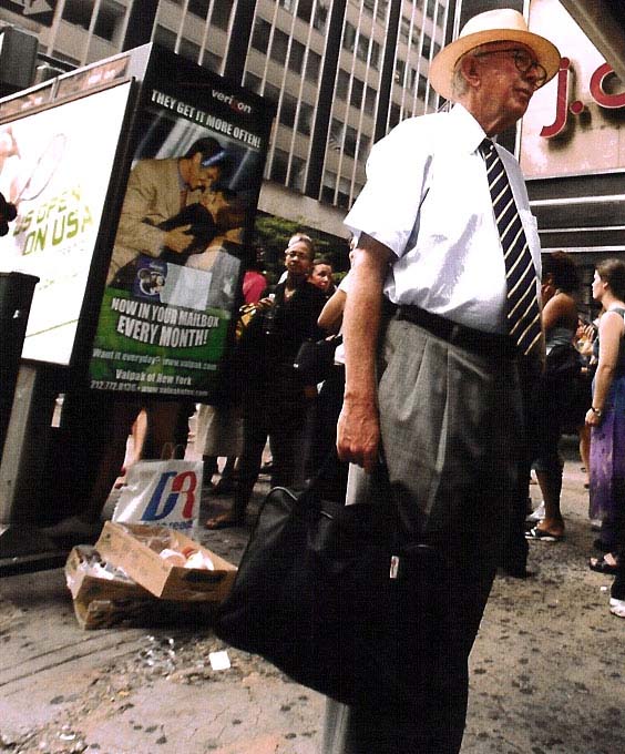 Man: Going home.  Check out the phone queue behind him