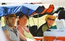 Marc, Diana and Peter keep tabs from the shade