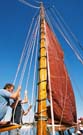 Laurant and Perry hauling the sails aloft